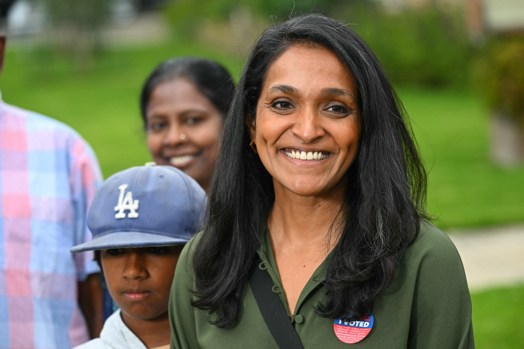 Los Angeles Councilmember Nithya Raman smiles, wearing an 