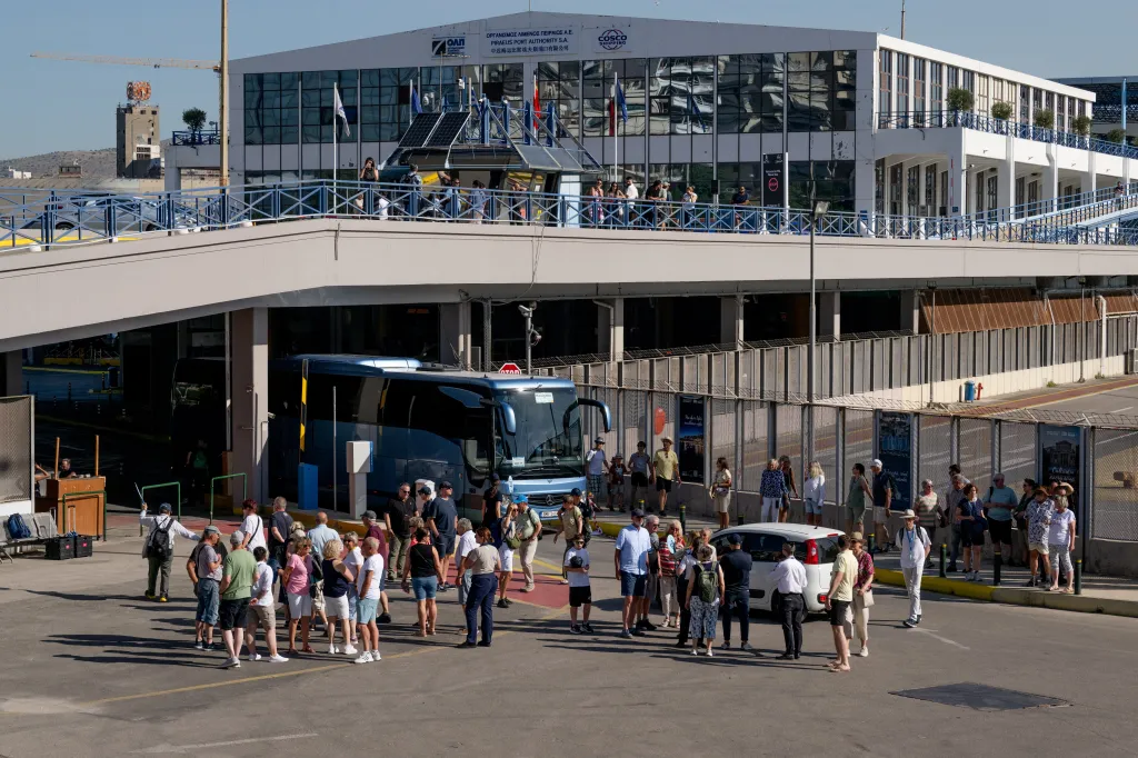 Israeli tourists gather before boarding buses at the port of Piraeus in Athens.