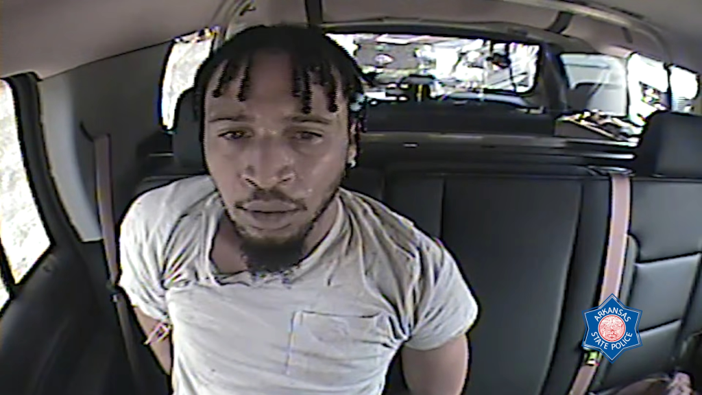 Tyrice Fletcher in custody in the back of a vehicle.