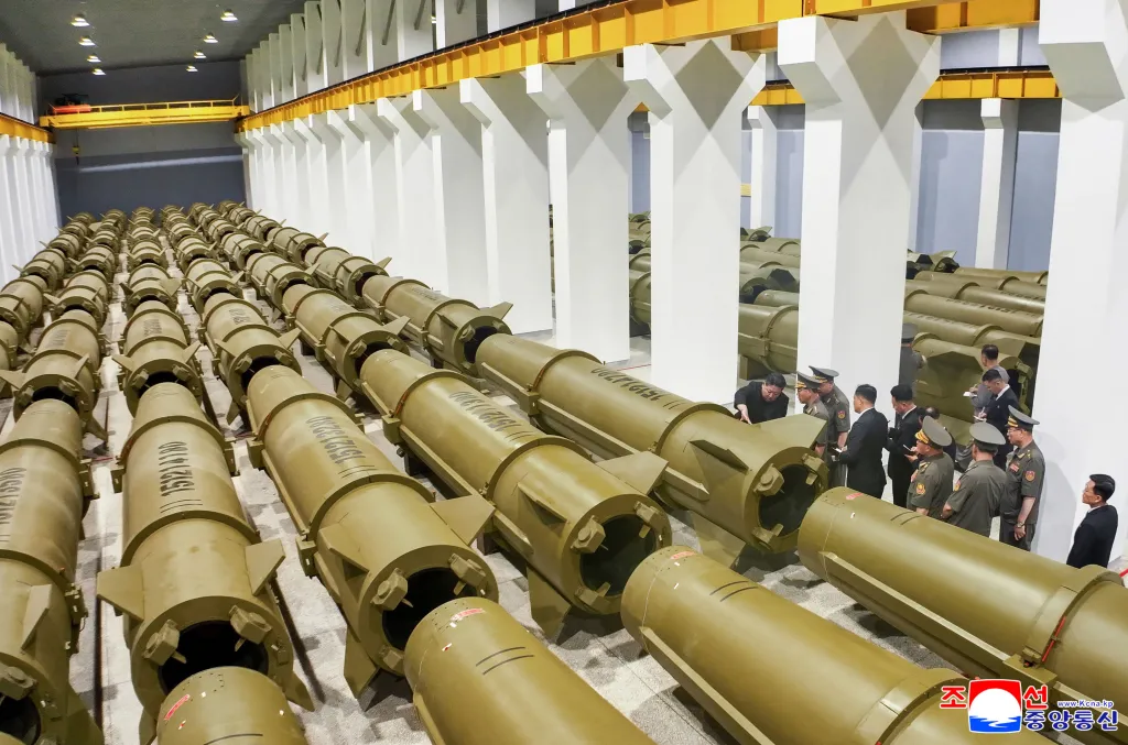 Kim Jong Un inspecting a factory full of large missile bodies.
