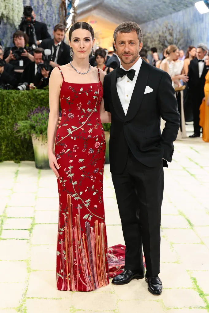 Bee Carrozzini in a red floral gown and Francesco Carrozzini in a black tuxedo at the Met Gala.