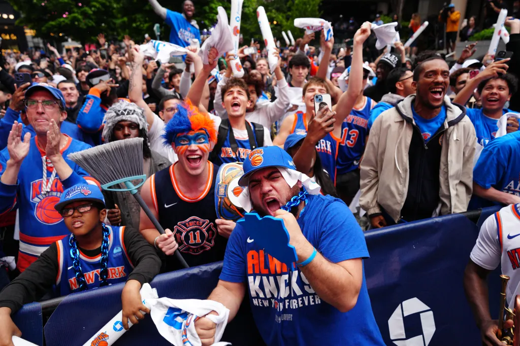 New York Knicks fans celebrate the team's playoff victory.