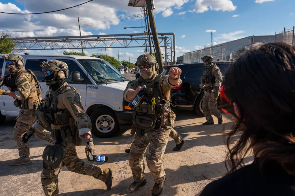 ICE agents protect vehicles entering Delaney Hall Immigration Detention Center.