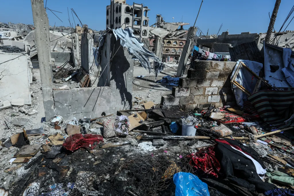 Rubble and debris, including a suit and other personal belongings, from a destroyed home in Khan Yunis.