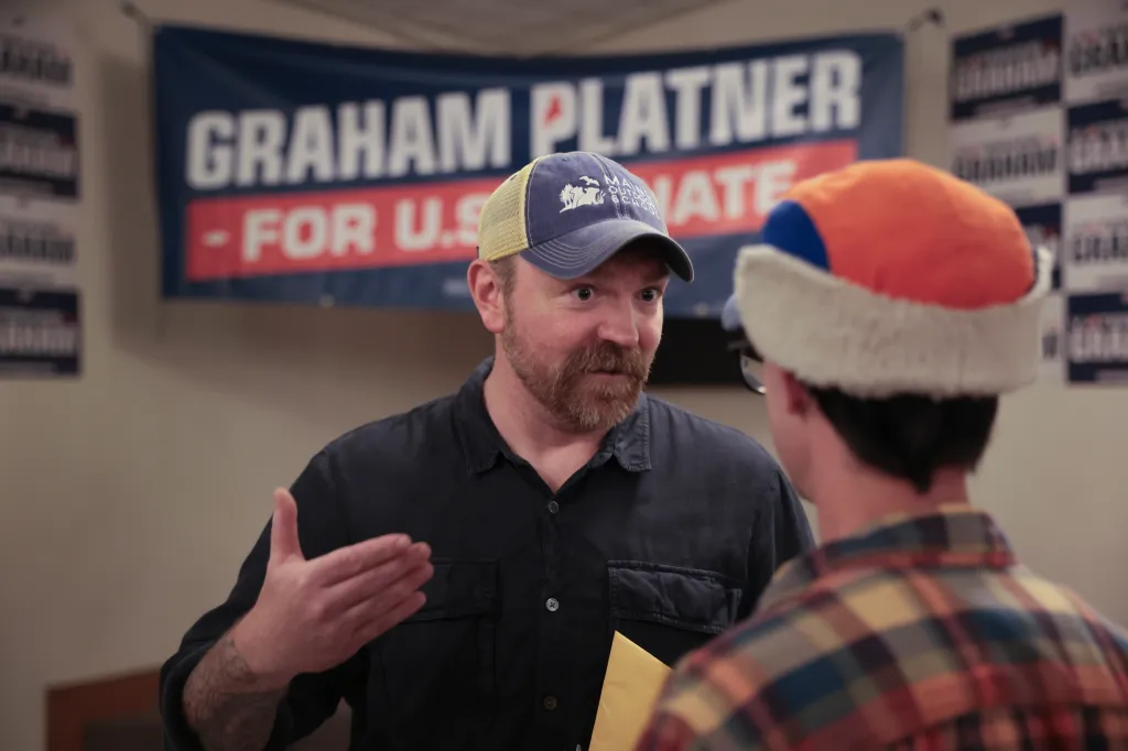Graham Platner, a Democratic candidate for Senate, speaking to an attendee at a campaign event.