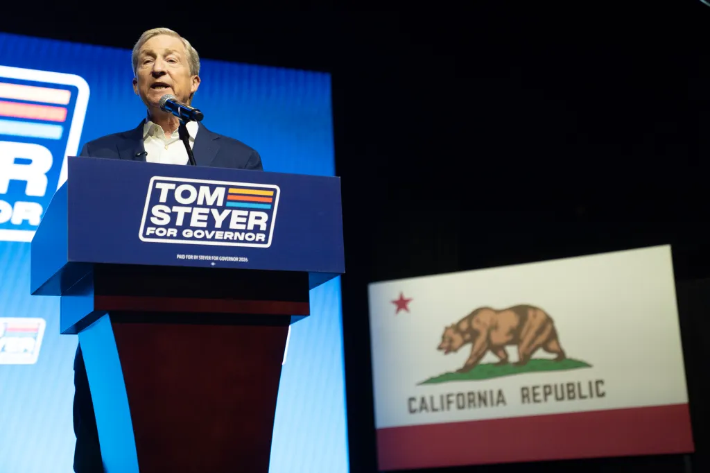 Tom Steyer speaks at a podium with 