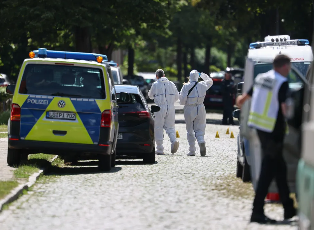 Police and rescue personnel work at the scene of a shooting in Stade, Germany.