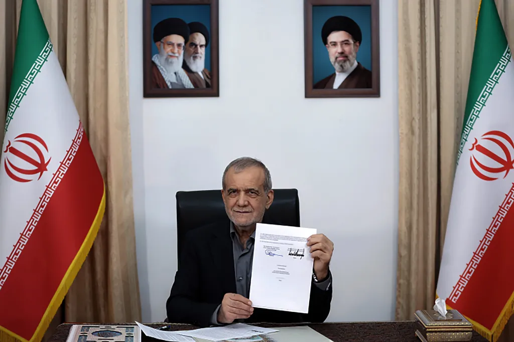 Iranian President Masoud Pezeshkian signs a memorandum of understanding in Tehran, Iran, on June 18, 2026.