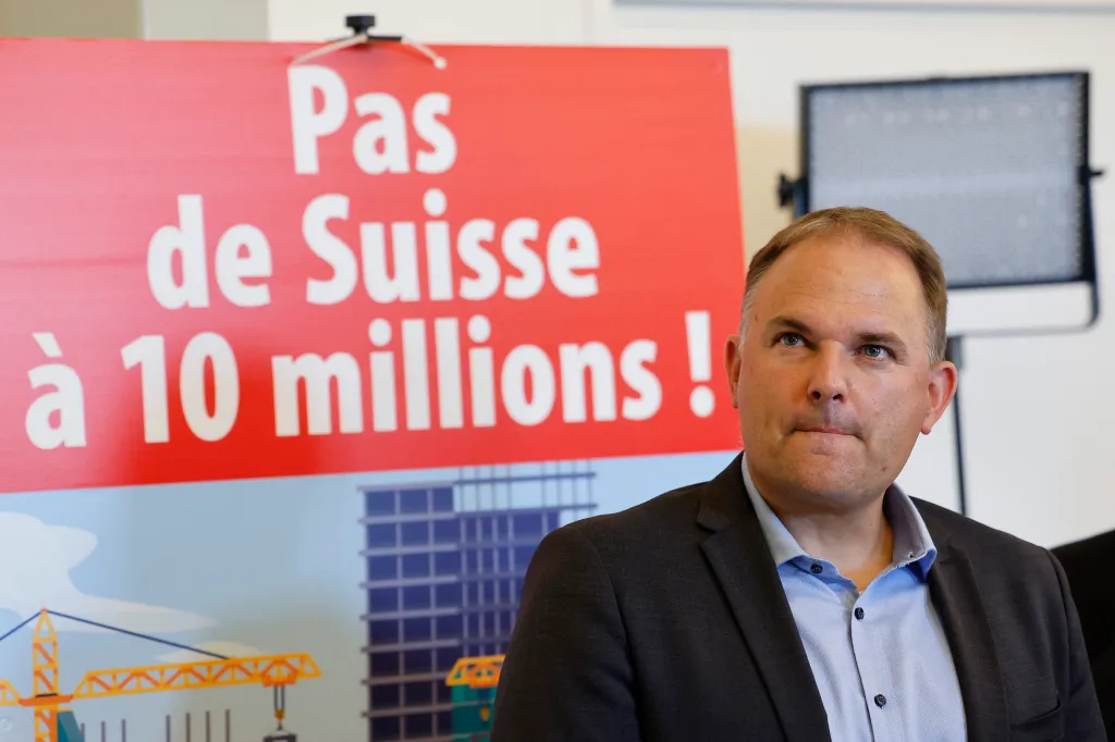 Swiss People's Party President Marcel Dettling reacts after the vote on an anti-immigration proposal.
