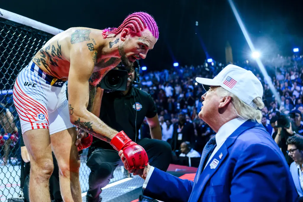 UFC fighter Sean O'Malley shakes hands with former U.S. President Donald Trump at a UFC event.