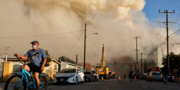 Warehouse Fire in L.A. Still Burns, Spreading Smoke Across Region