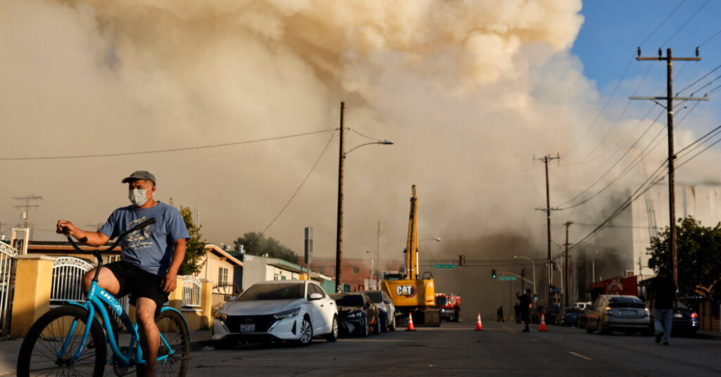 Warehouse Fire in L.A. Still Burns, Spreading Smoke Across Region