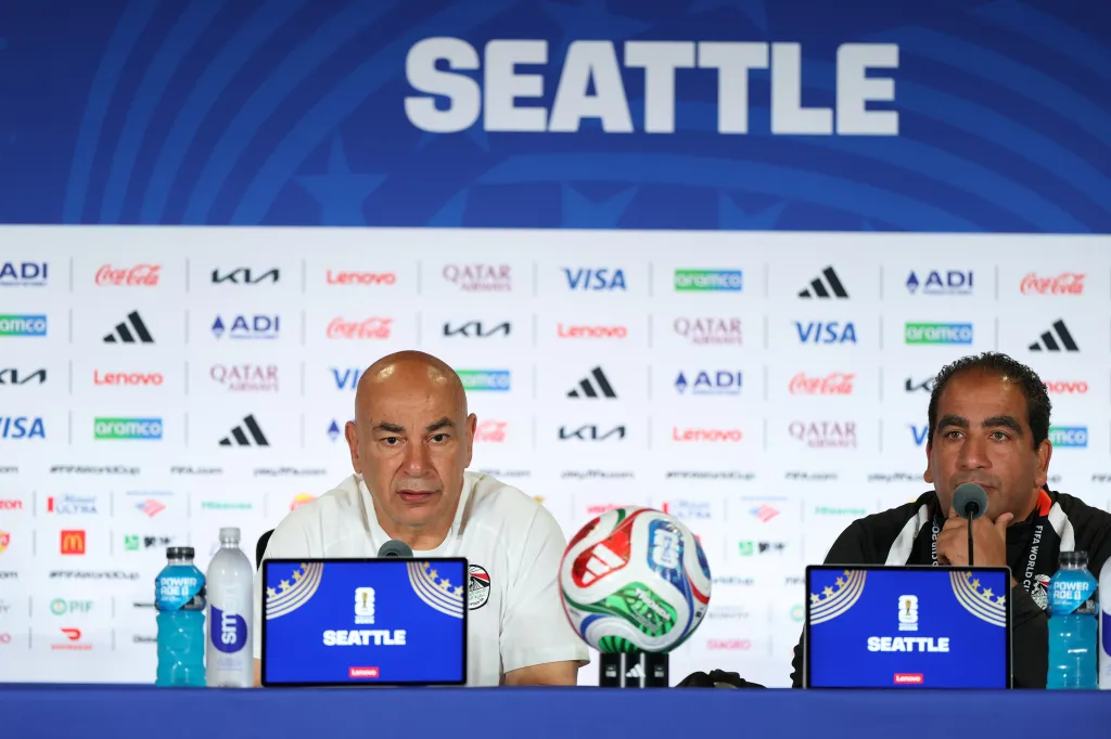 Two men from the Egypt team at a FIFA World Cup 2026 press conference in Seattle.