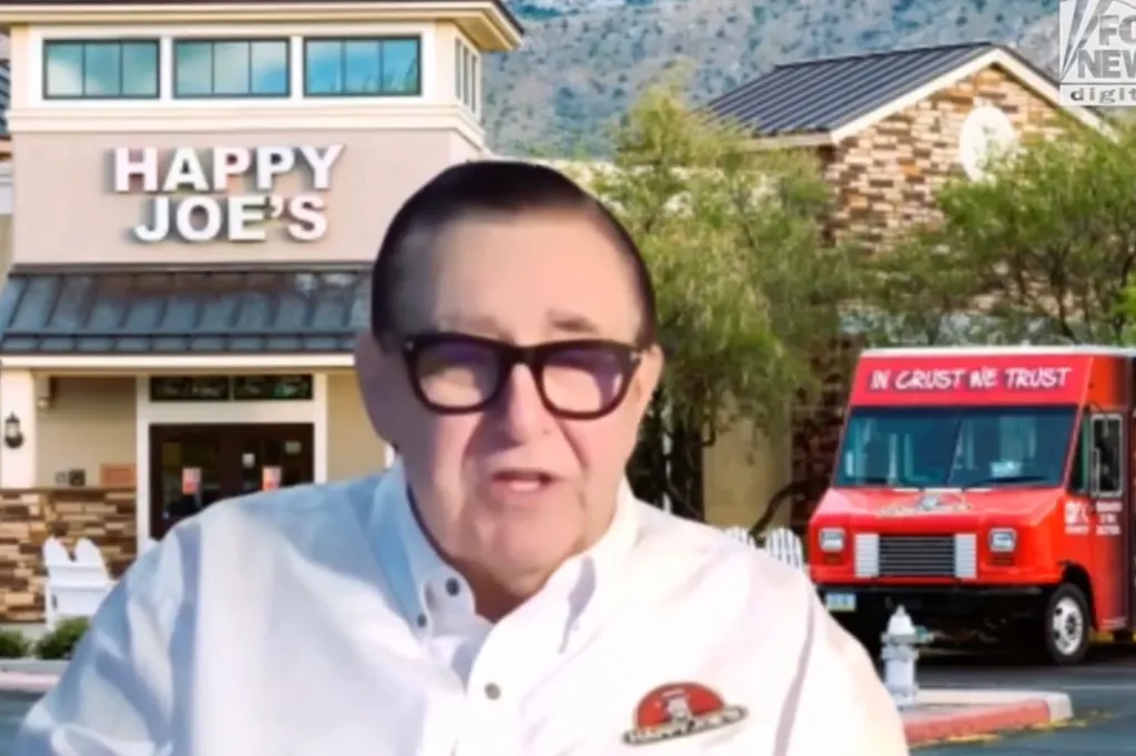 Tom Sacco, CEO of Happy Joe's, in front of a Happy Joe's restaurant and pizza truck.