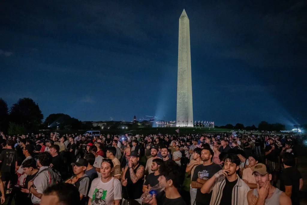 Spectators gather at night on the Washington Monument grounds for UFC Freedom 250.