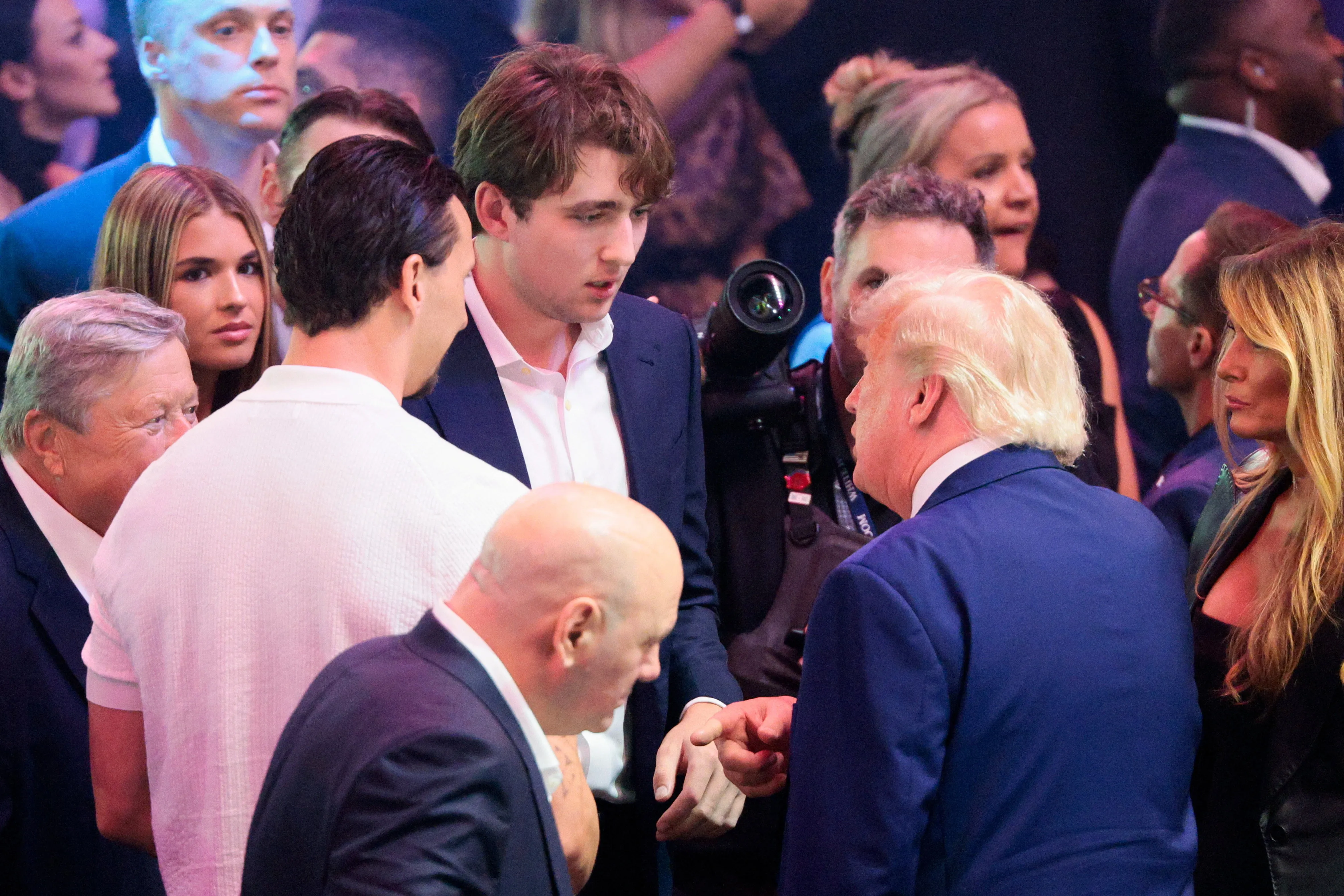 Donald Trump talking to his son Barron Trump at UFC Freedom 250.
