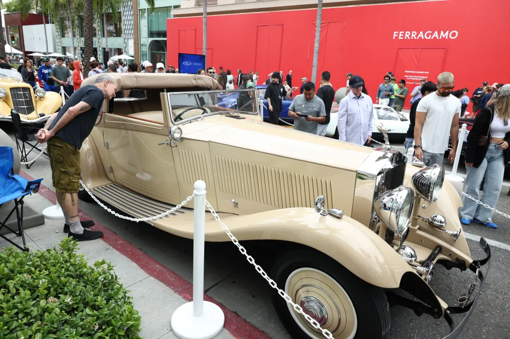 A tan vintage car on display at the 31st Annual Rodeo Drive Concours d’Elegance.