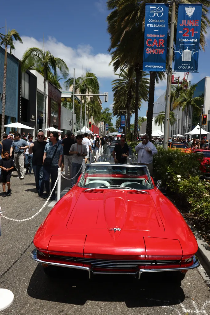 A red classic convertible car on display at the 31st Annual Rodeo Drive Concours d'Elegance.