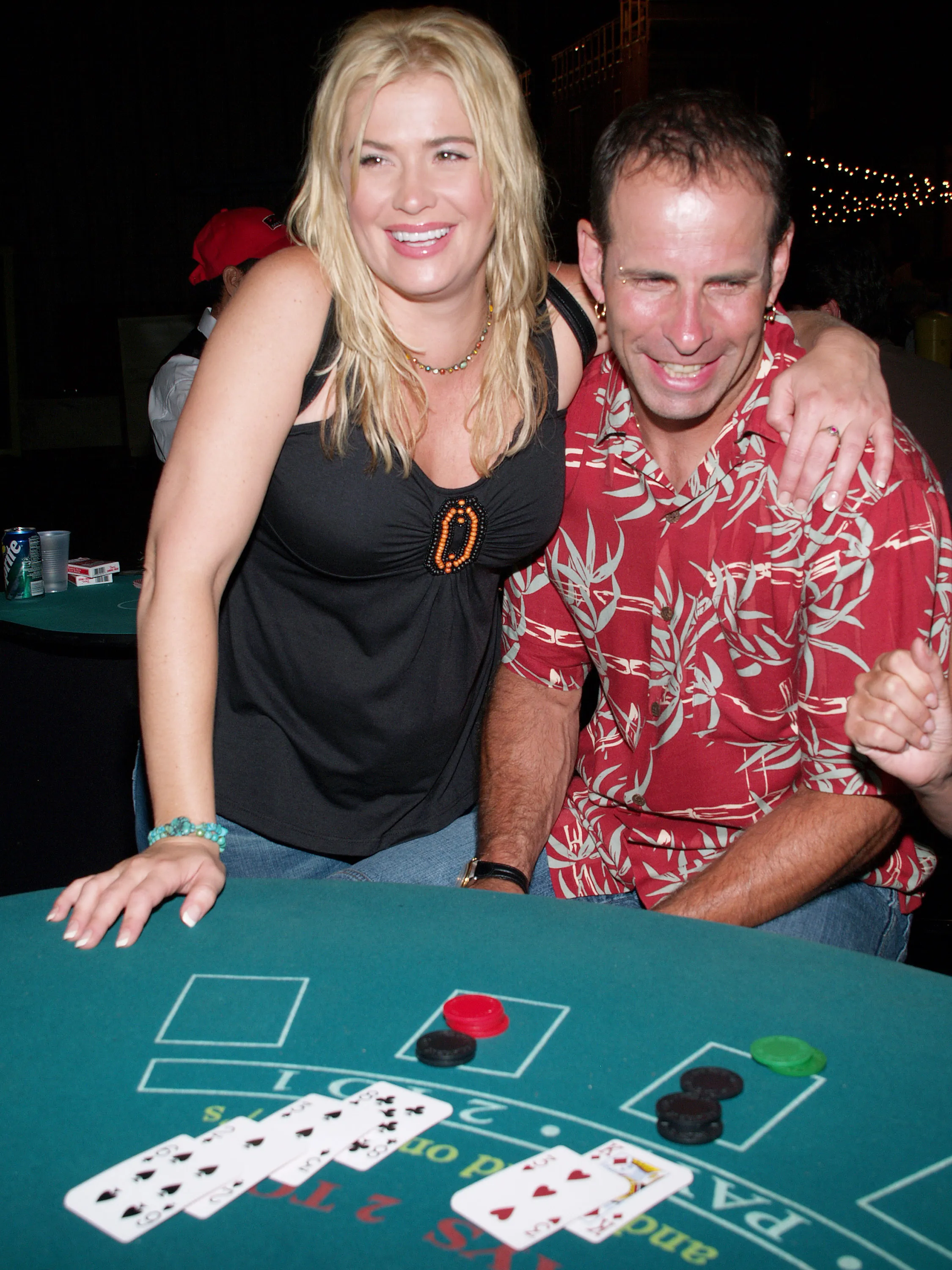 Kristy Swanson and Lloyd Eisler playing cards at The Concern Foundation for Cancer Research - 32nd Annual Block Party.