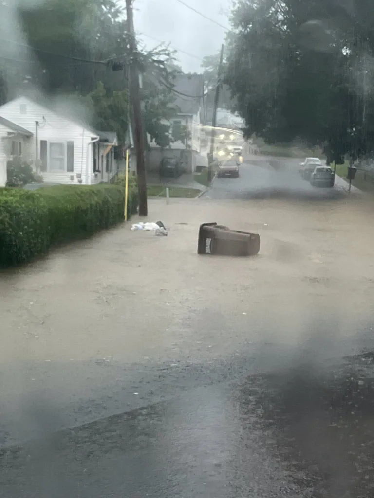 A portion of a residential street is flooded by water after a heavy rainstorm struck Kentucky.