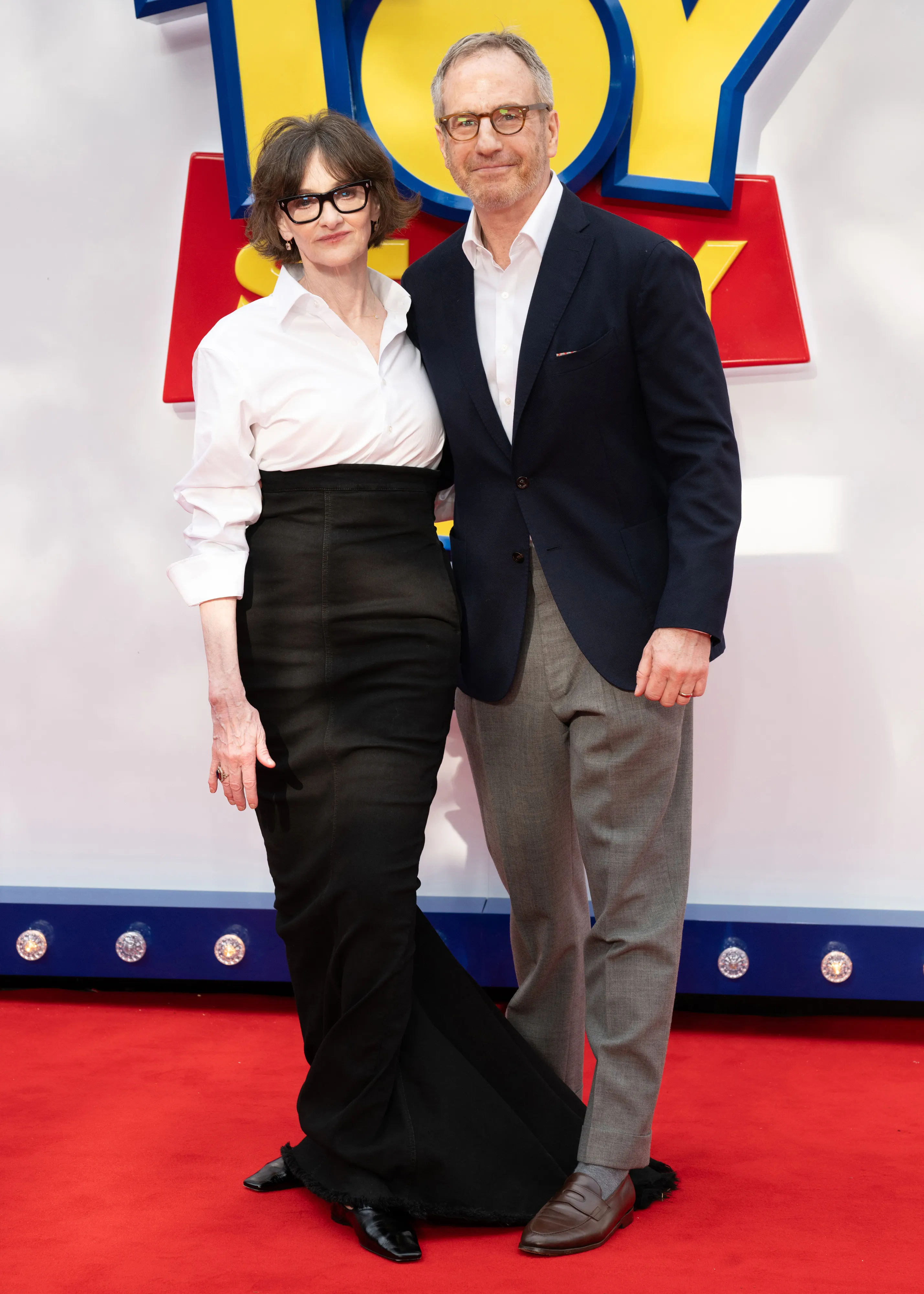 Joan Cusack and a man on the red carpet at the 