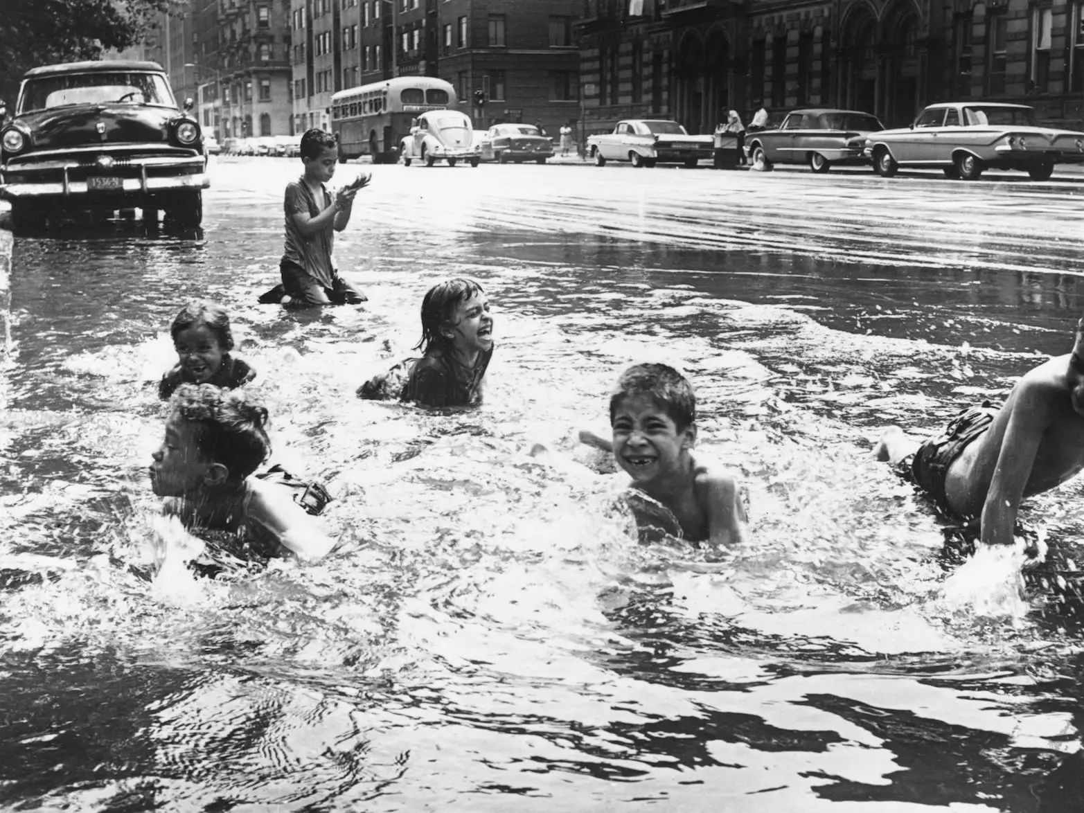 kids playing fire hydrant flood
