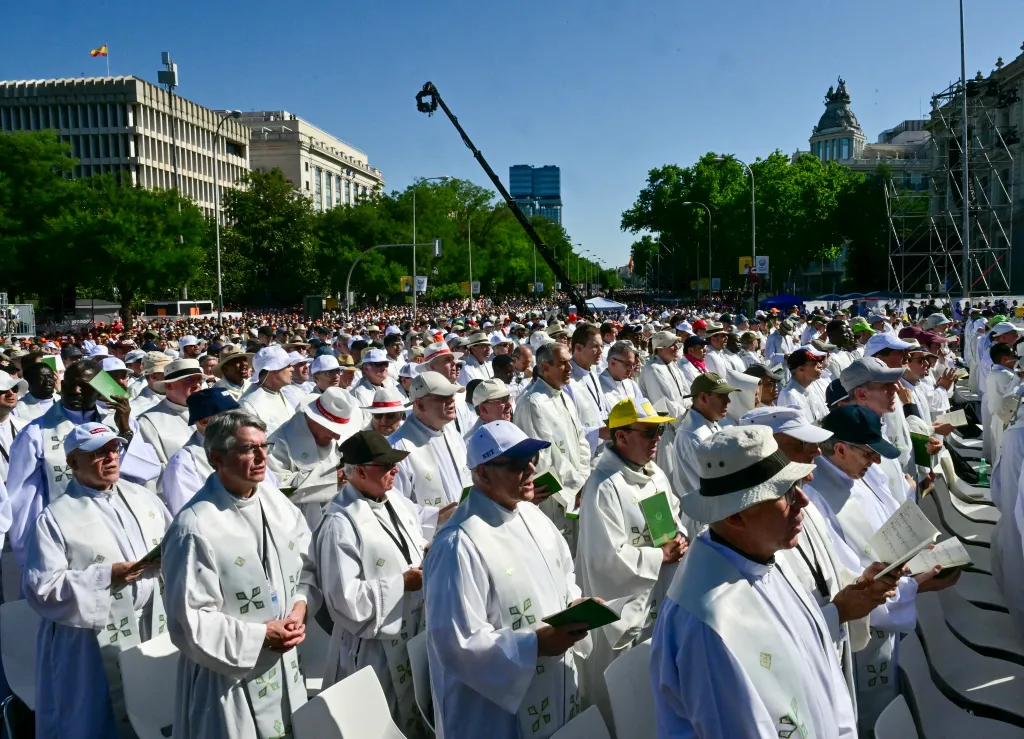 Priests attend Holy Mass led by Pope Leo XIV in Plaza de Cibeles in Madrid.