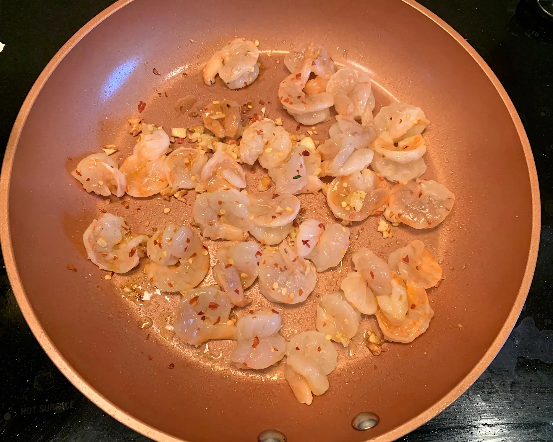 Shrimp and red pepper flakes in the saute pan