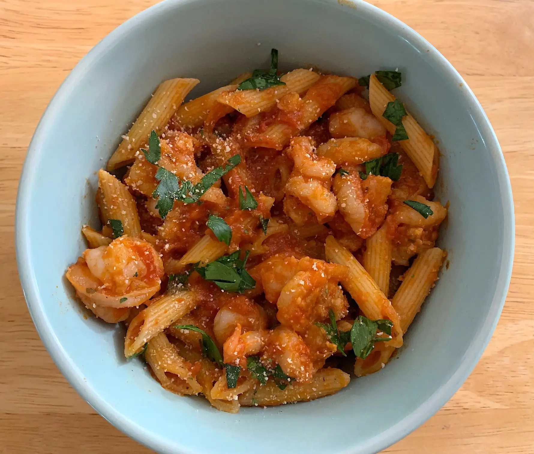 The finished pasta and shrimp in a bowl