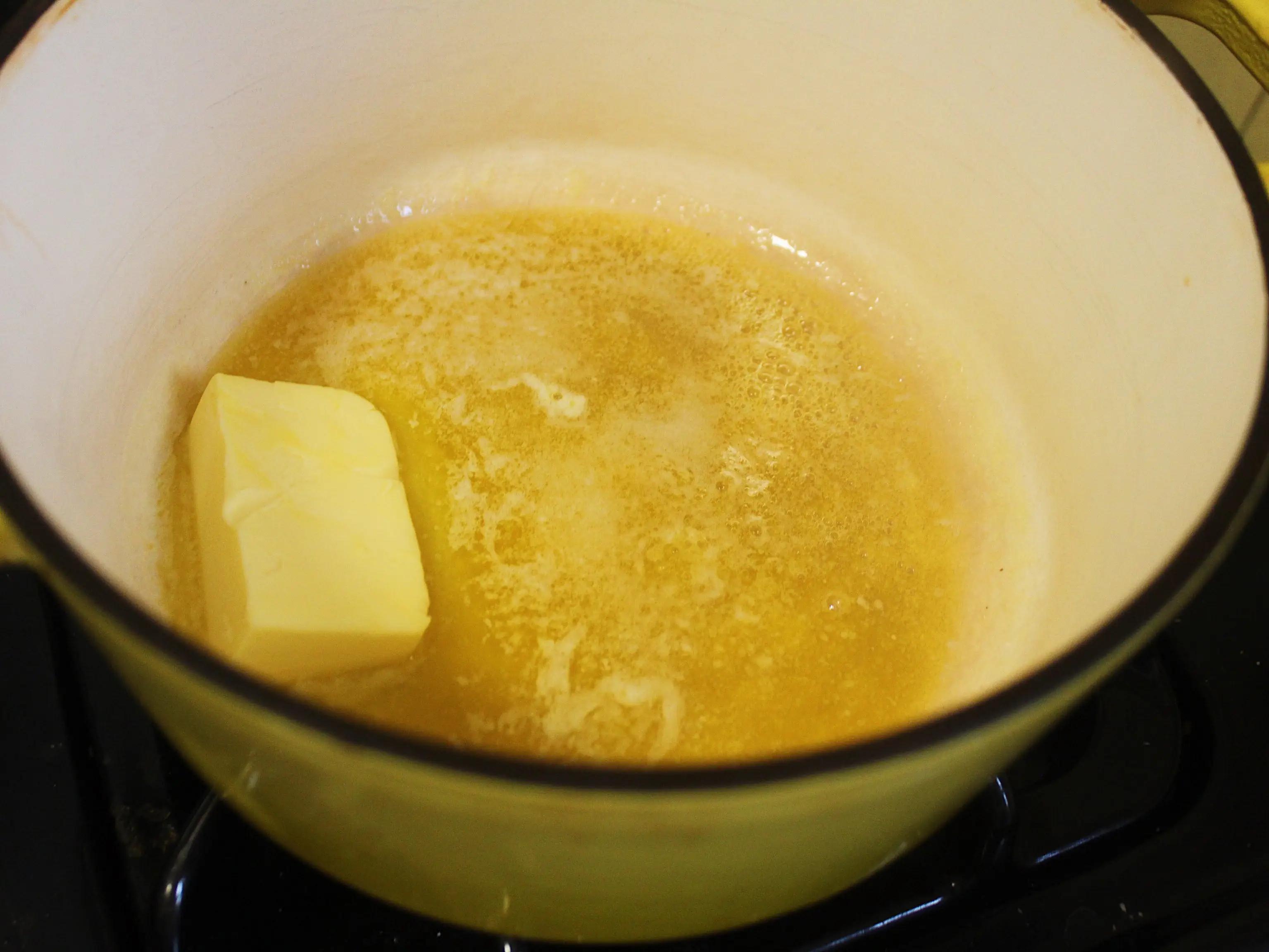 butter melting in a pot on the stove
