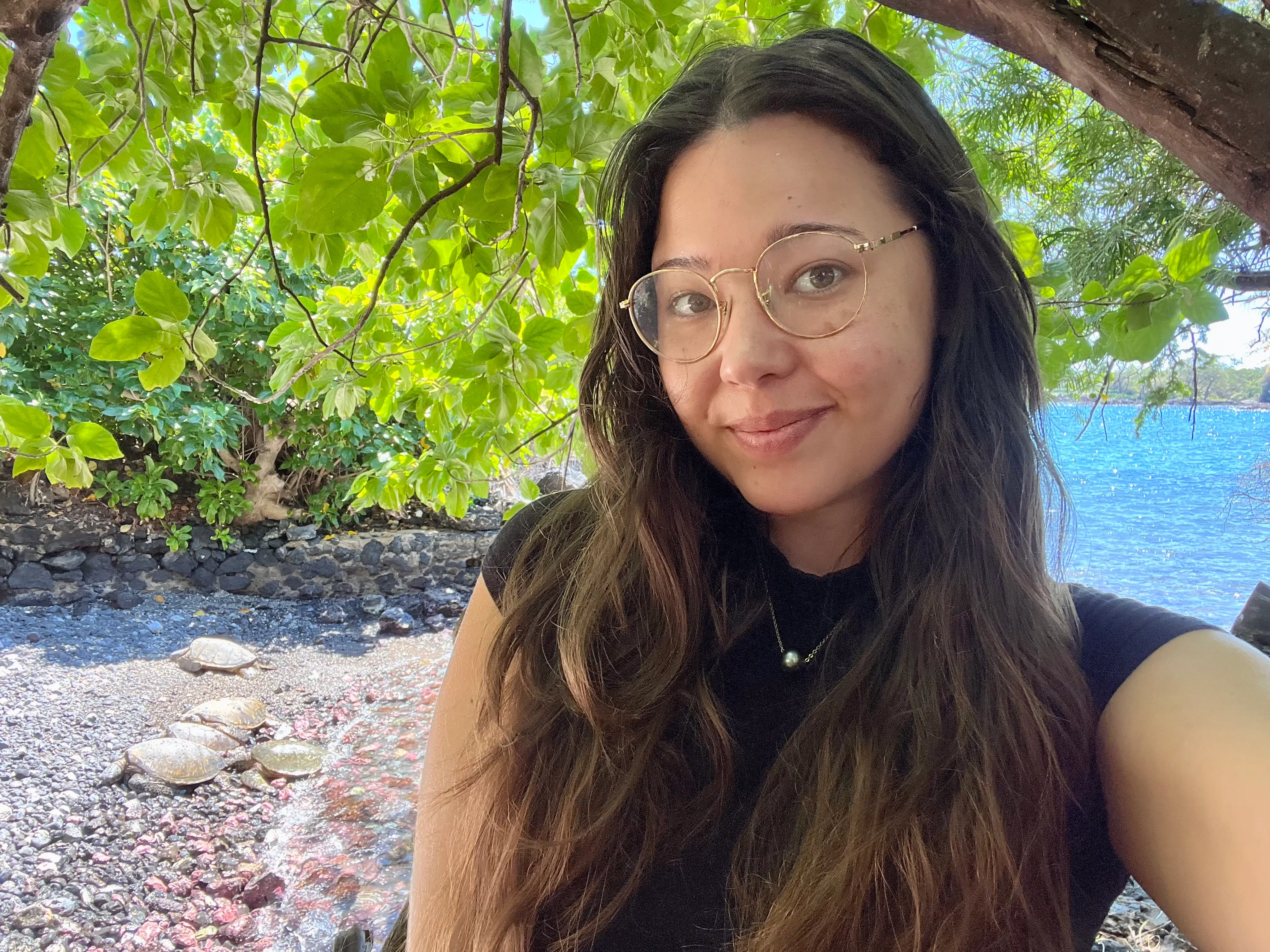 The writer taking a selfie within an appropriate distance from sunbathing turtles.