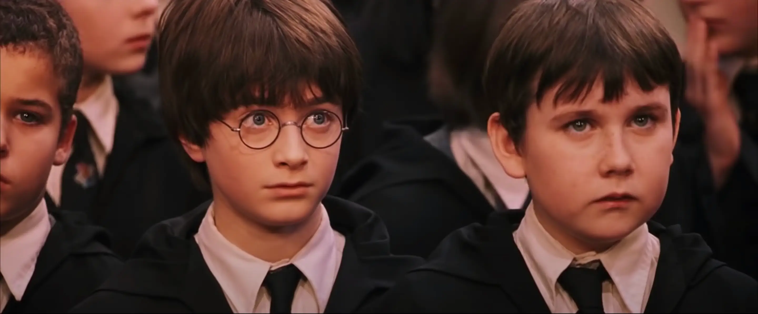 Daniel Radcliffe as Harry Potter and Matthew Lewis as Neville Longbottom in
