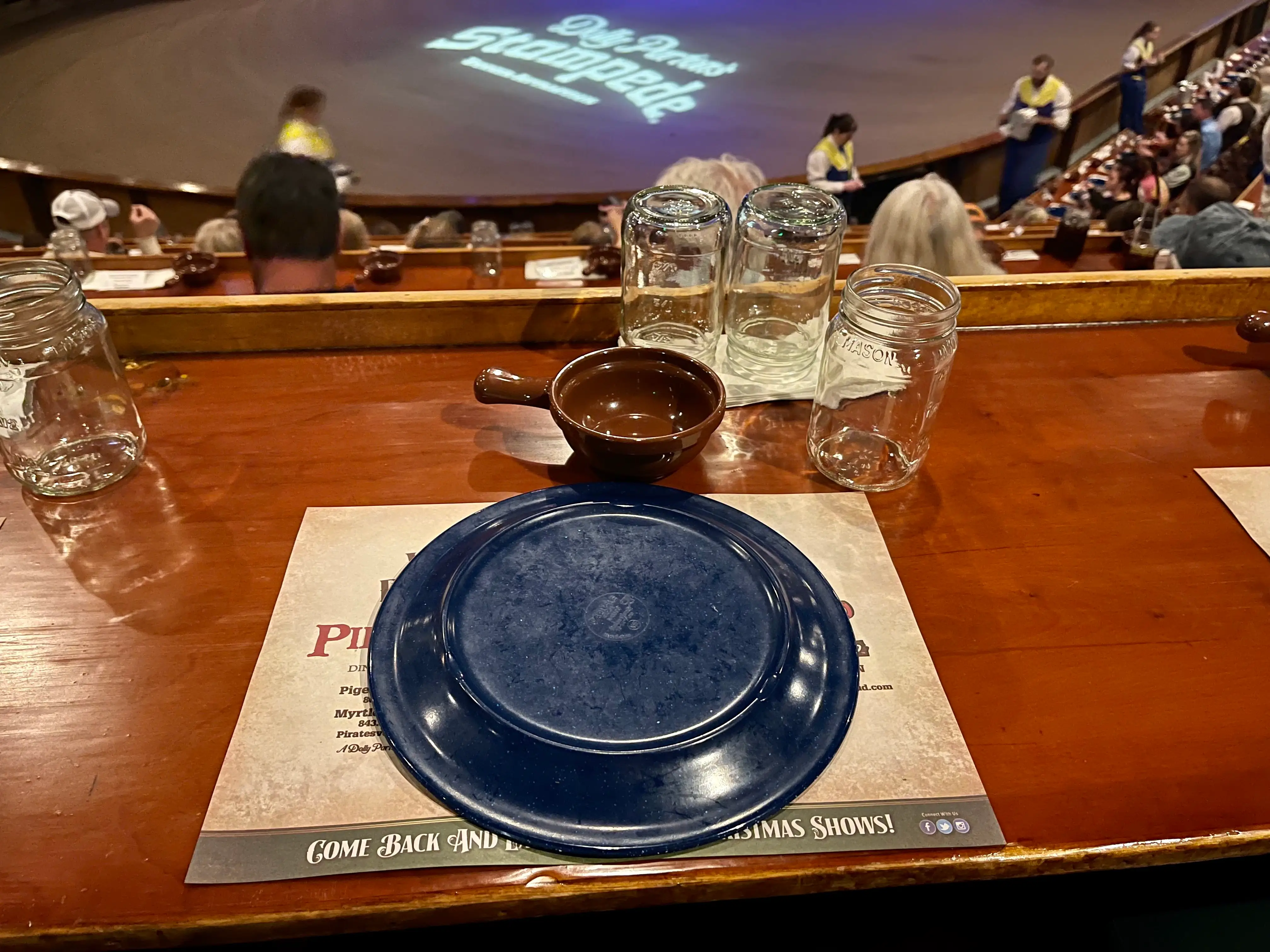 Dolly Parton's Stampede plate and menu on counter