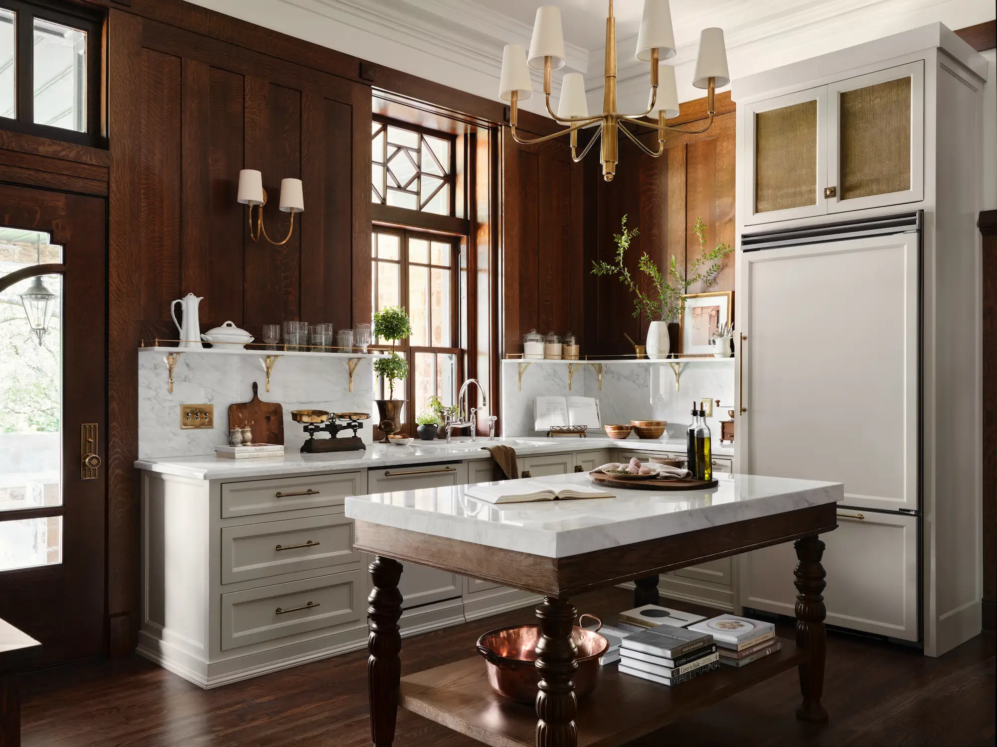 A kitchen with white countertops and a big white refrigerator.