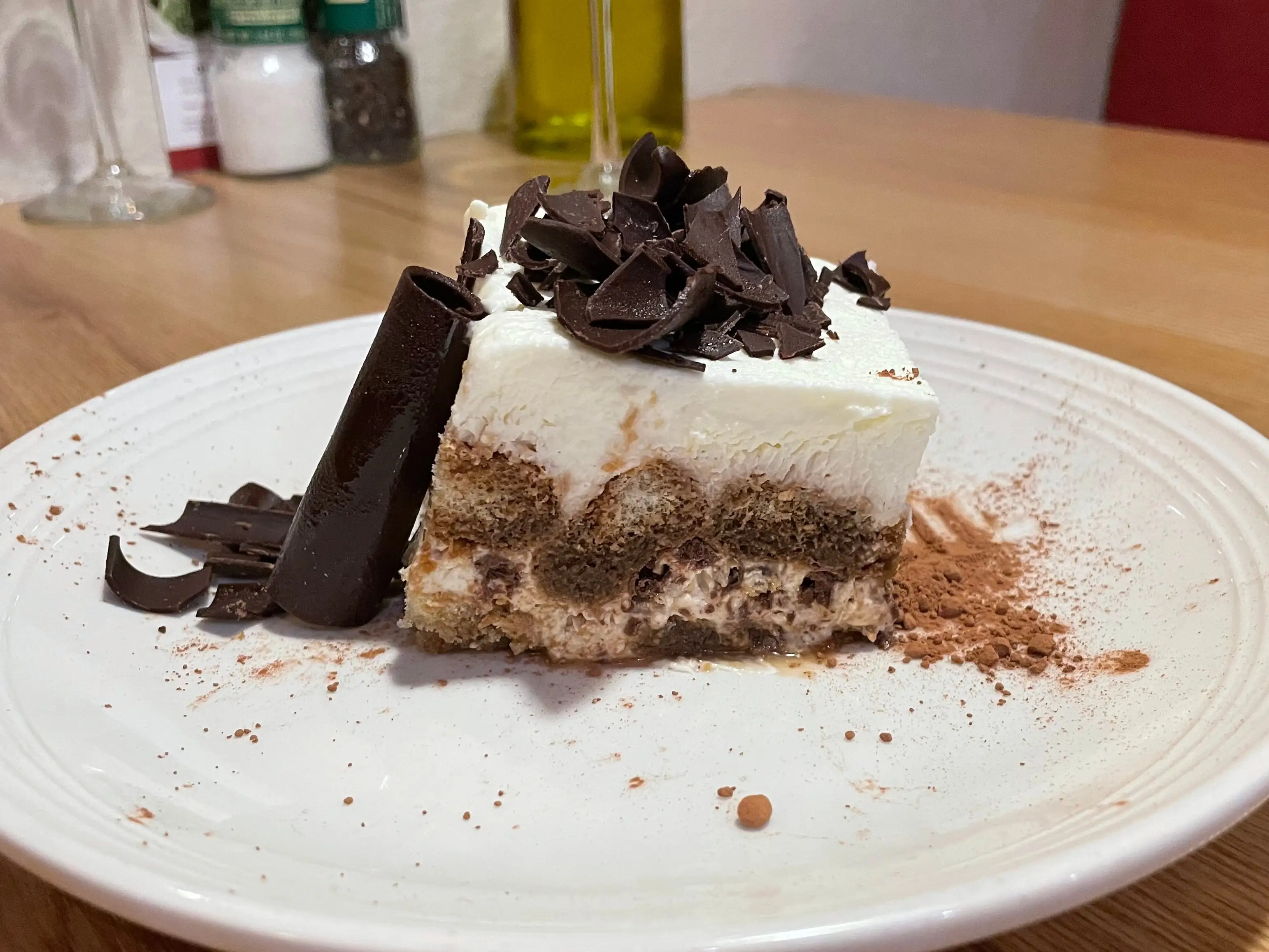 A tiramisu with chocolate shavings on top.
