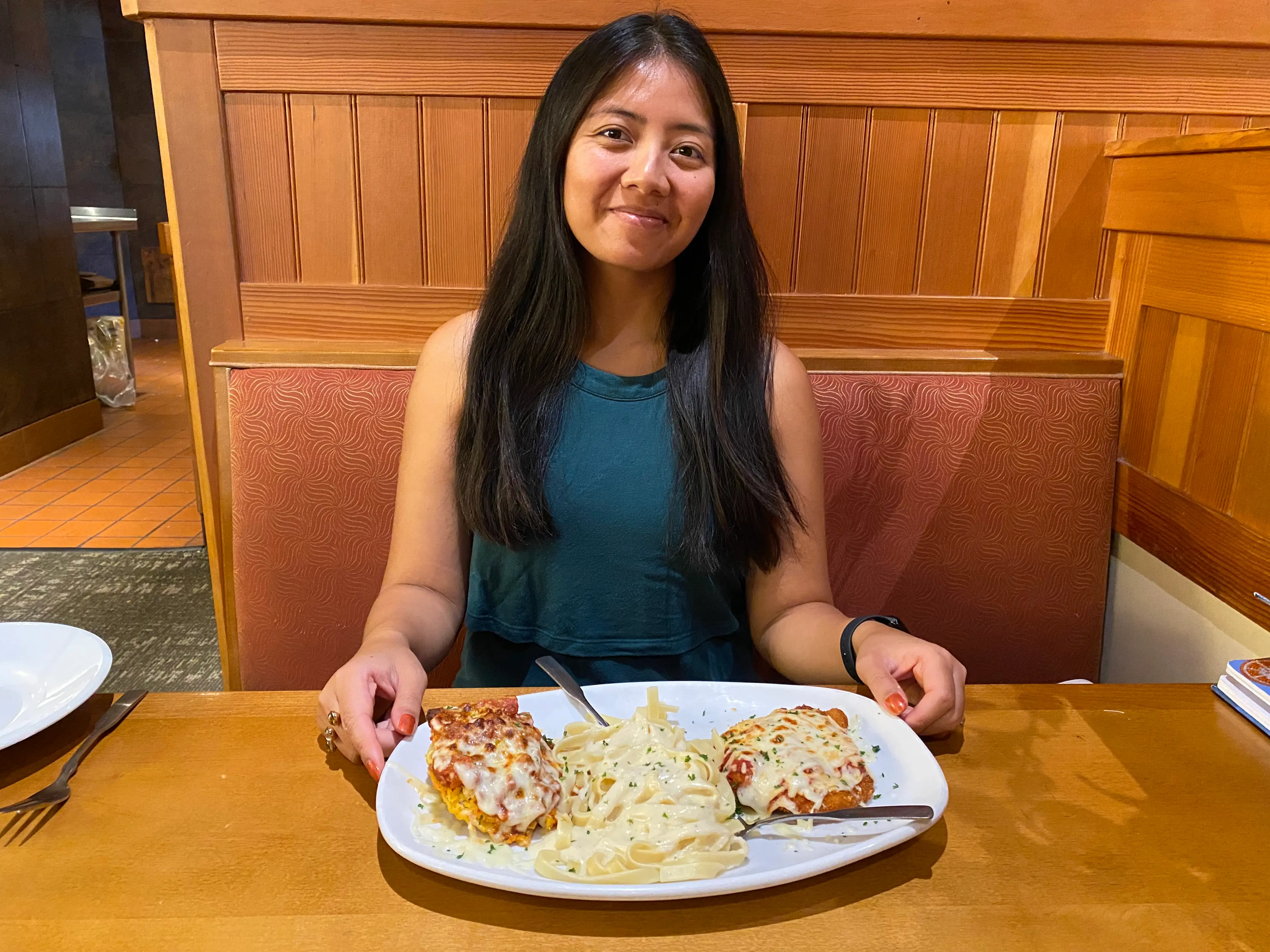 The writer poses with the Tour of Italy dish at Olive Garden