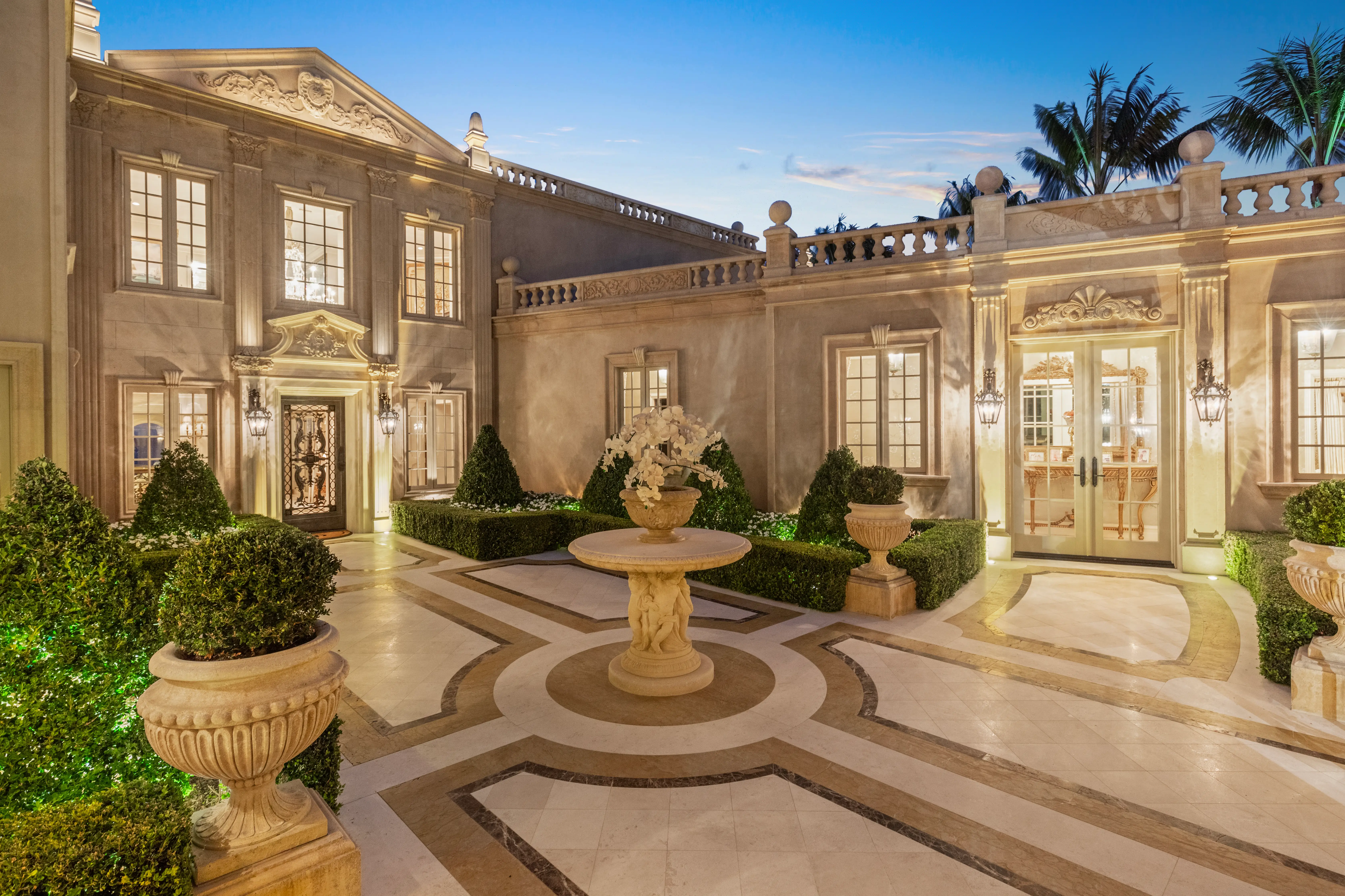 The courtyard of the Sand Castle mansion, featuring white marble.