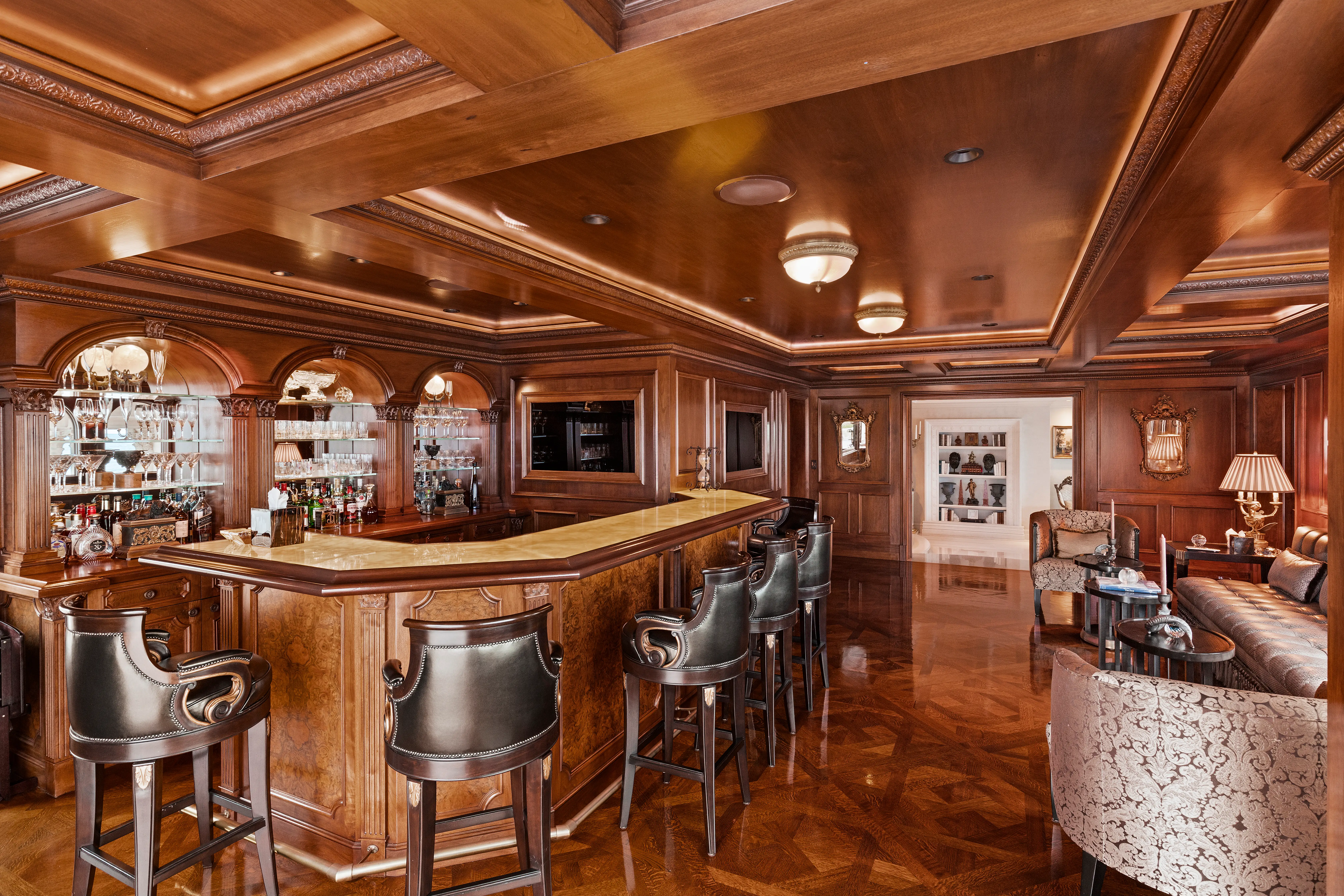 A bar in the Sand Castle mansion, featuring wall-to-ceiling wood paneling.