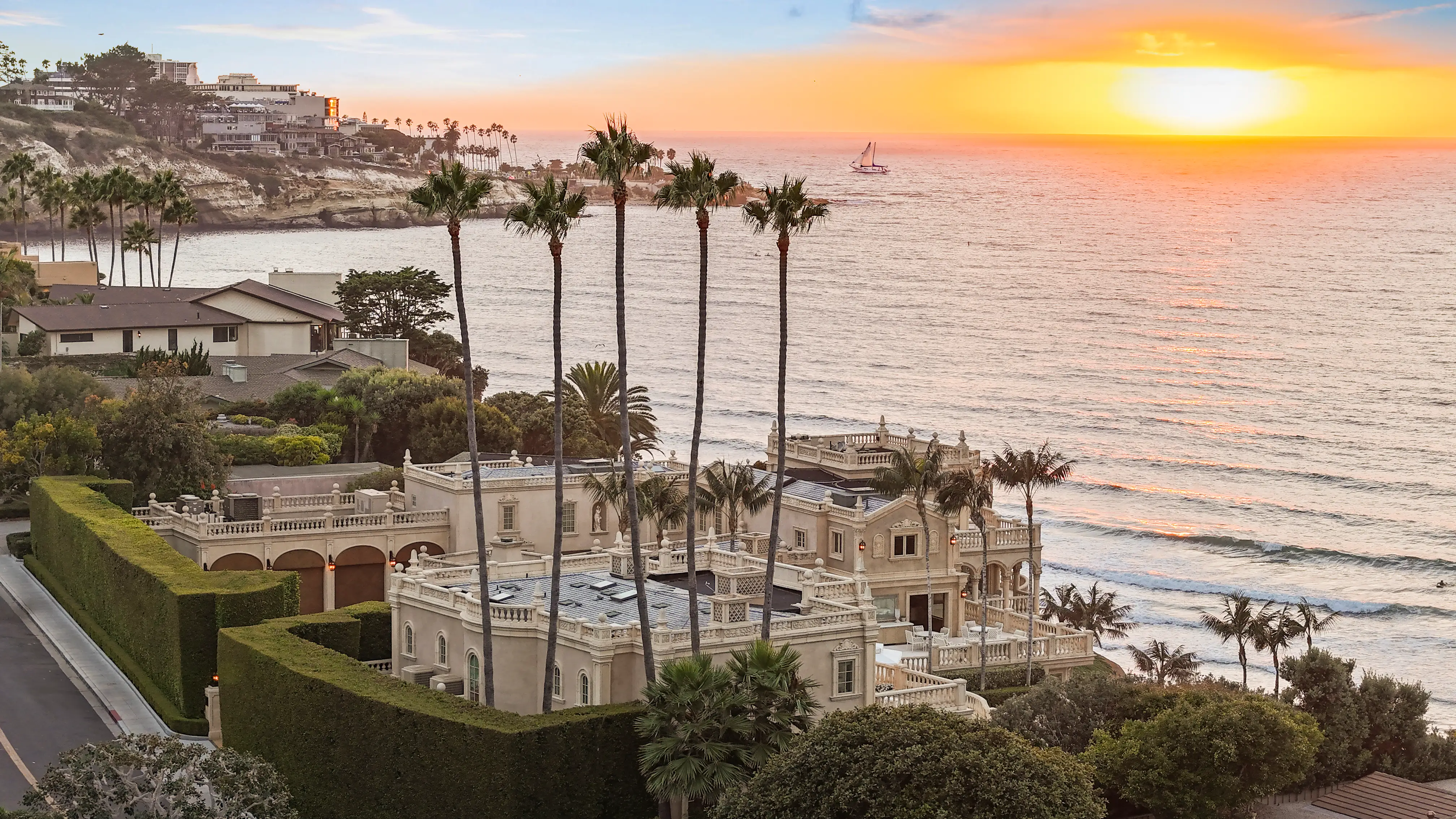 An aerial view of the Sand Castle mansion at sunset.