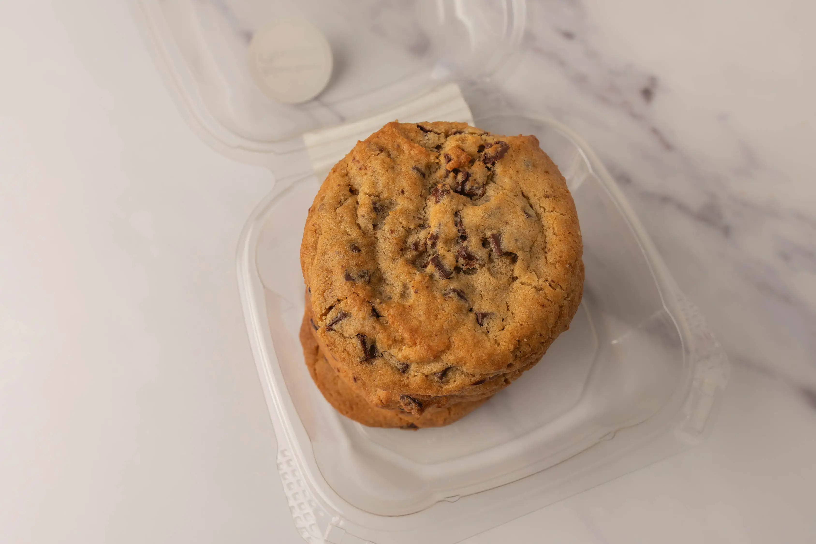 Stack of chocolate chunk cookies in clamshell package from Wholefoods
