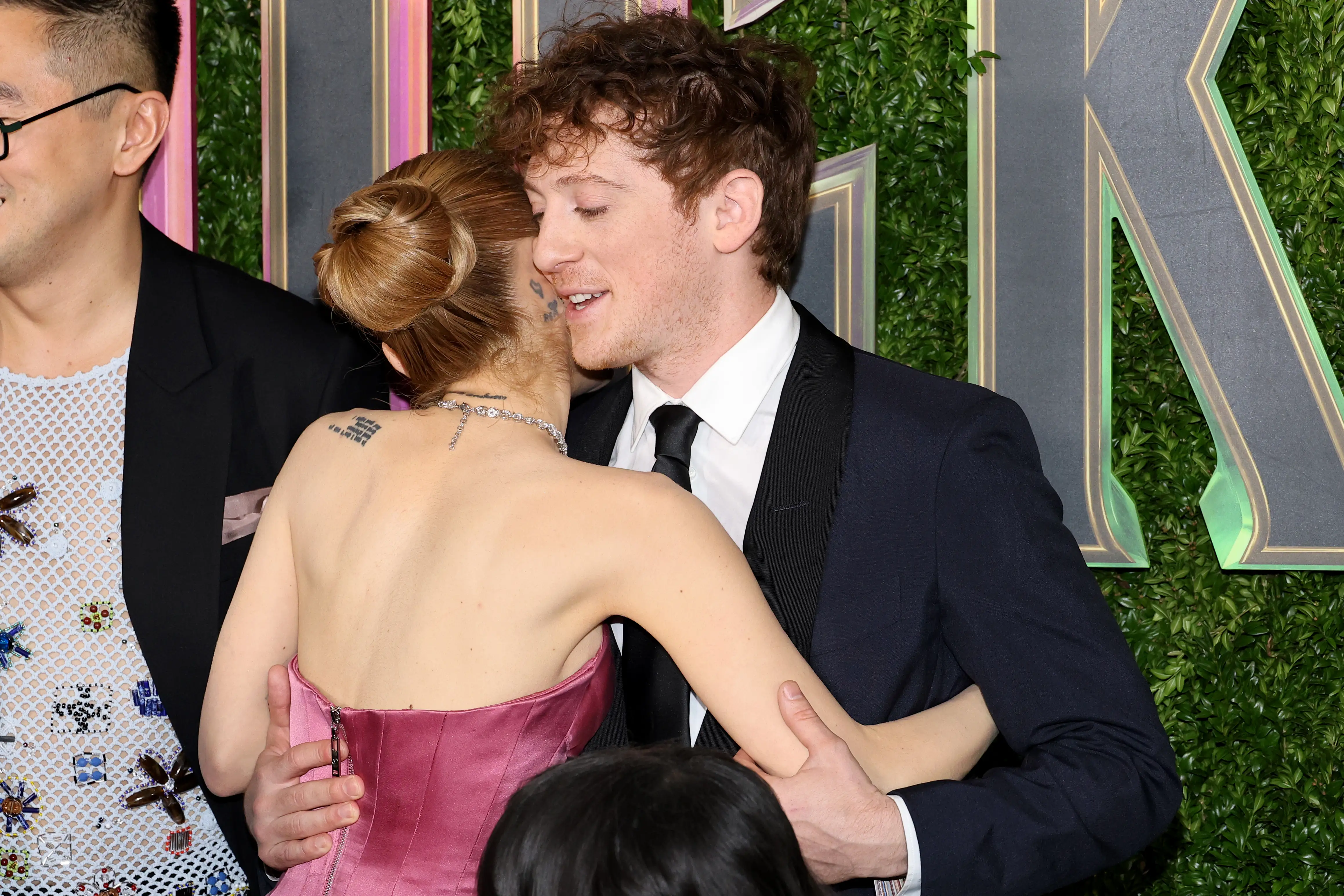 Ariana Grande and Ethan Slater hug at the