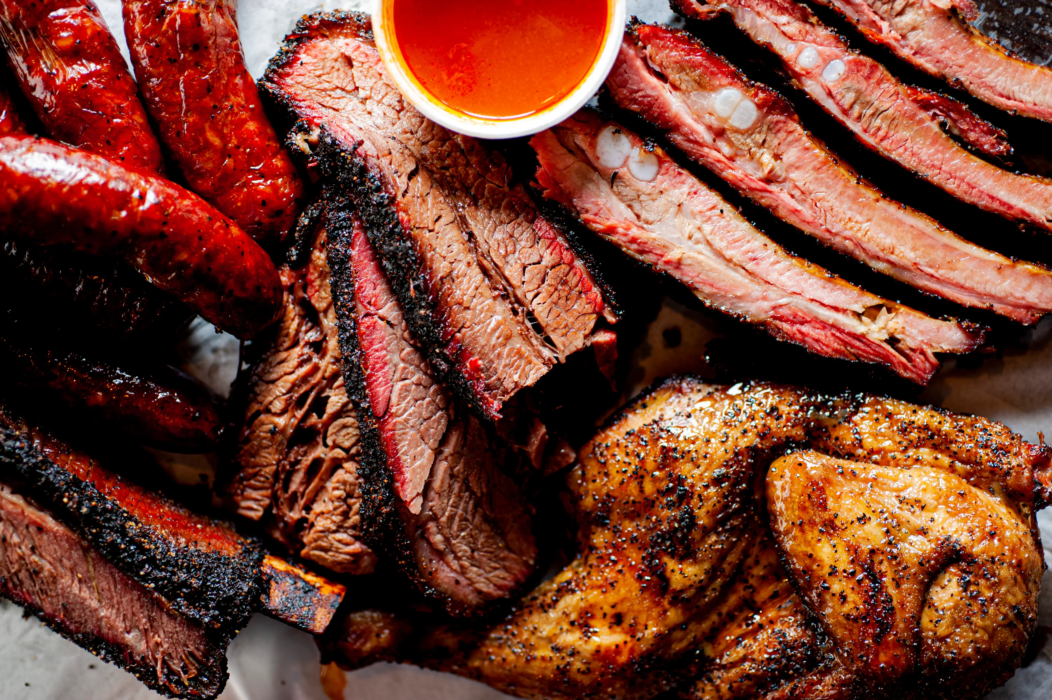 Barbecue spread with chicken, brisket, and sausages