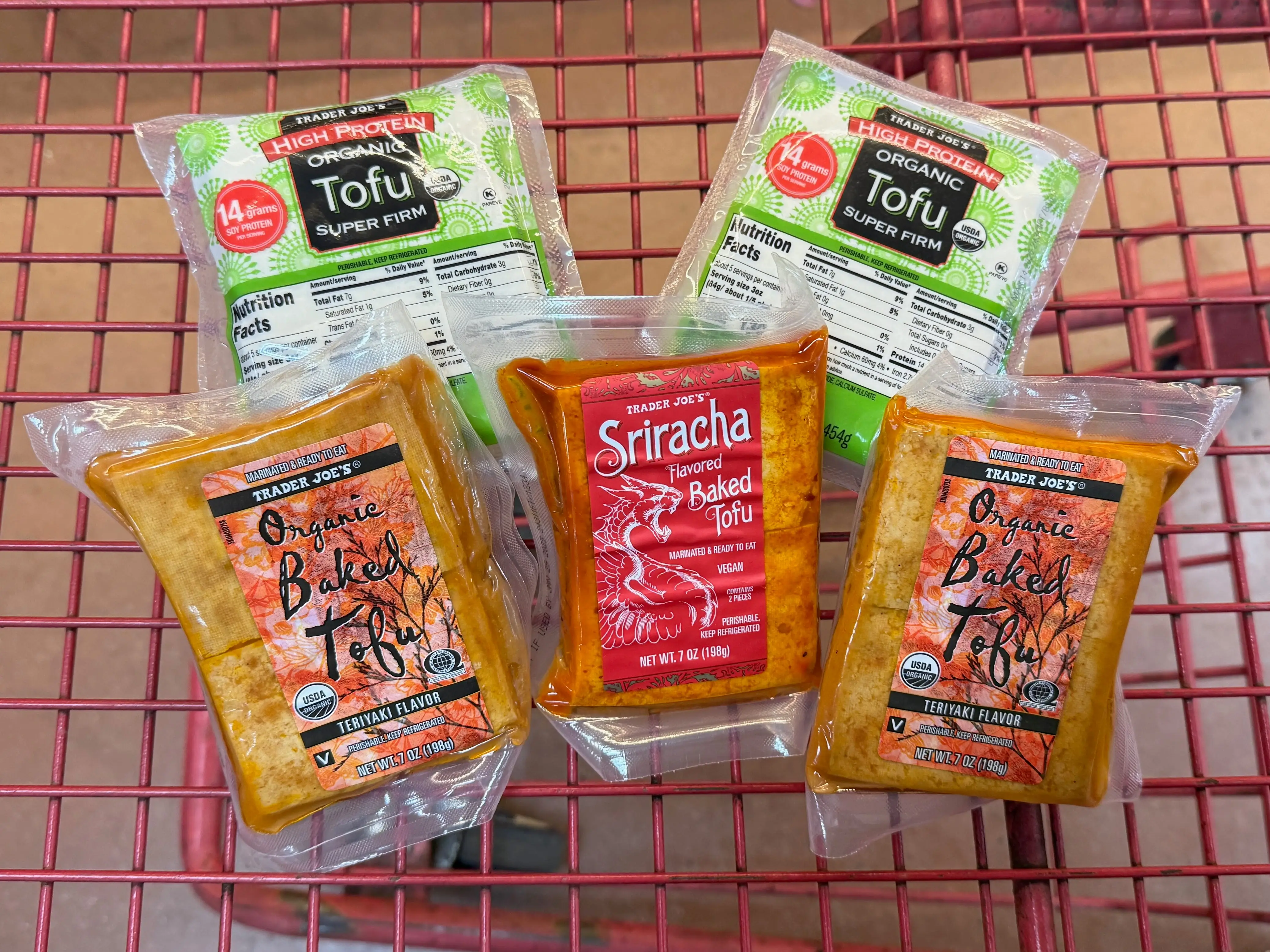 different blocks of tofu in a cart from trader joe's