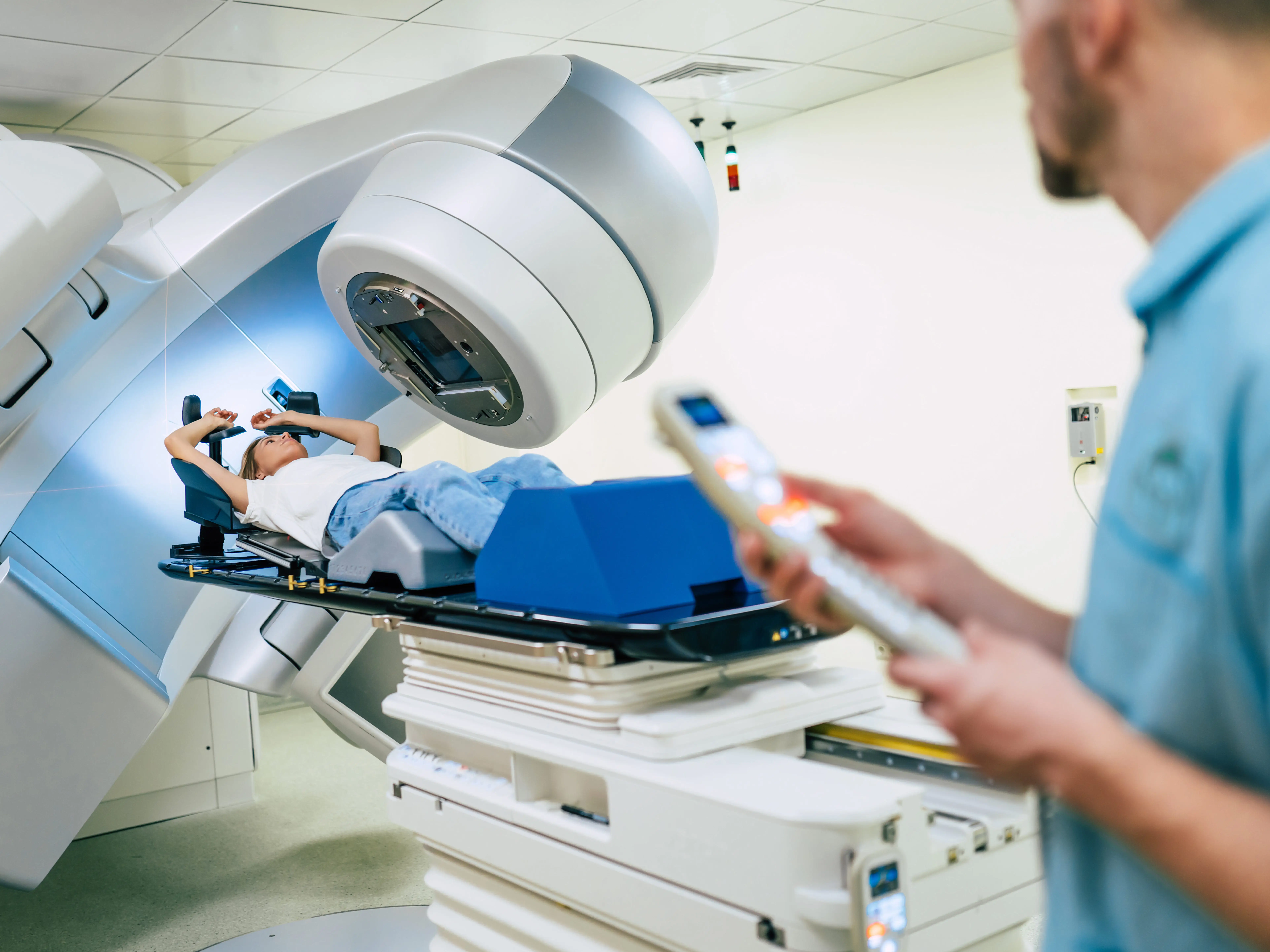 Healthcare worker, patient, and a linear accelerator