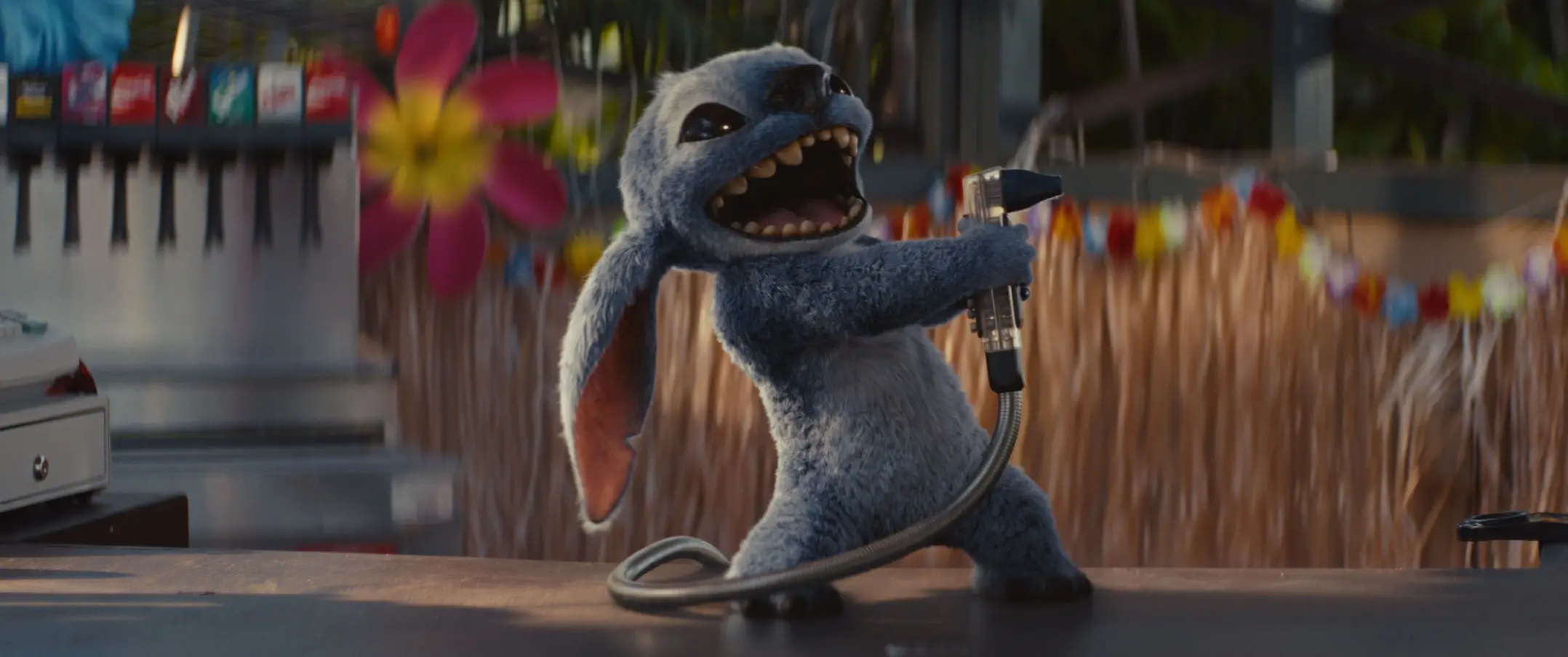 Stitch spraying a drink dispenser while standing on a bar in