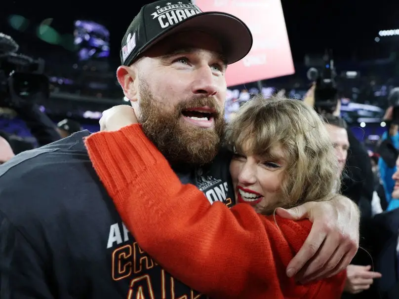 Travis Kelce #87 of the Kansas City Chiefs celebrates with Taylor Swift after a 17-10 victory against the Baltimore Ravens in the AFC Championship Game at M&T Bank Stadium on January 28, 2024 in Baltimore, Maryland.