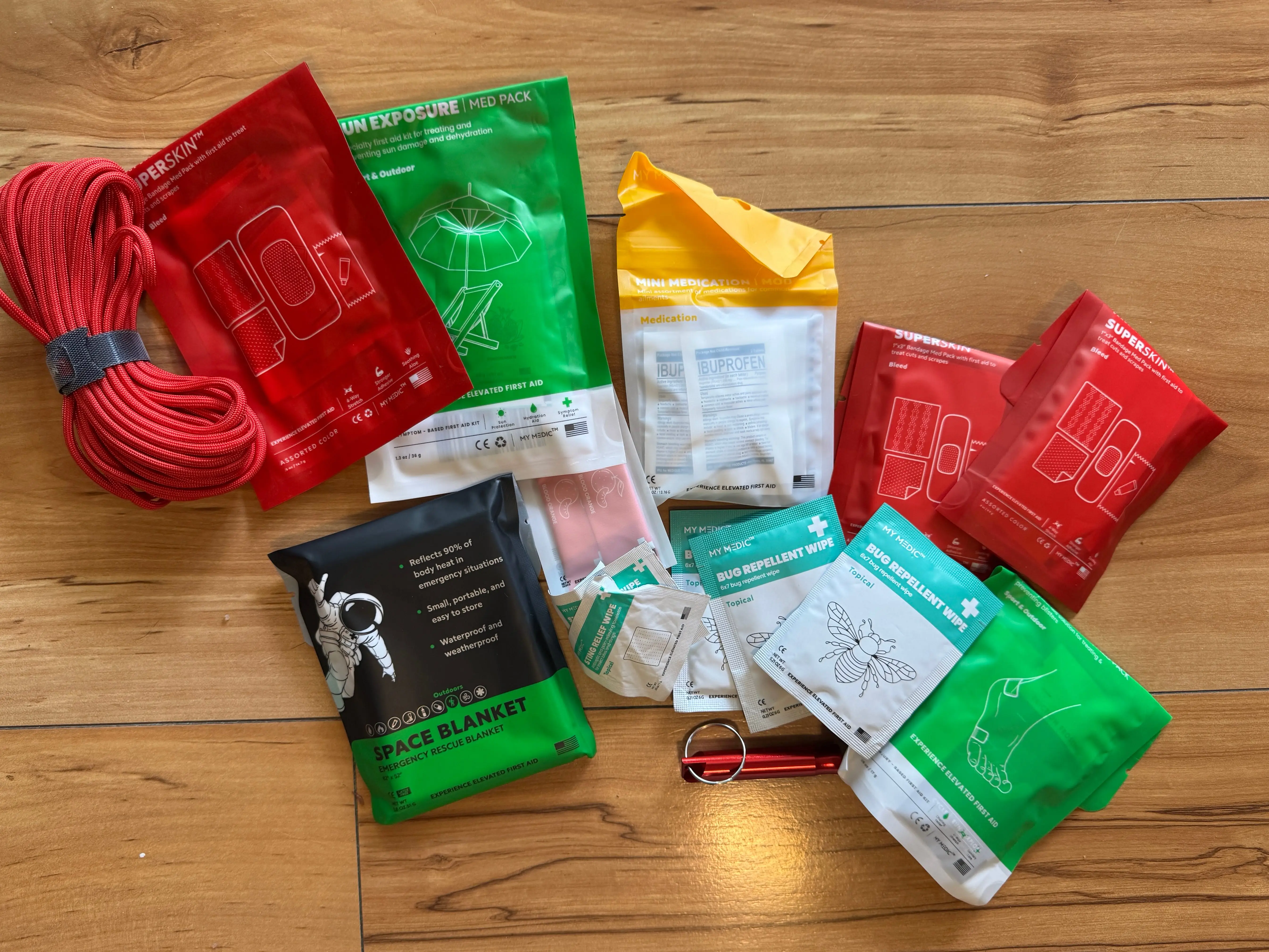 Contents of a first aid kit spread out on the floor.
