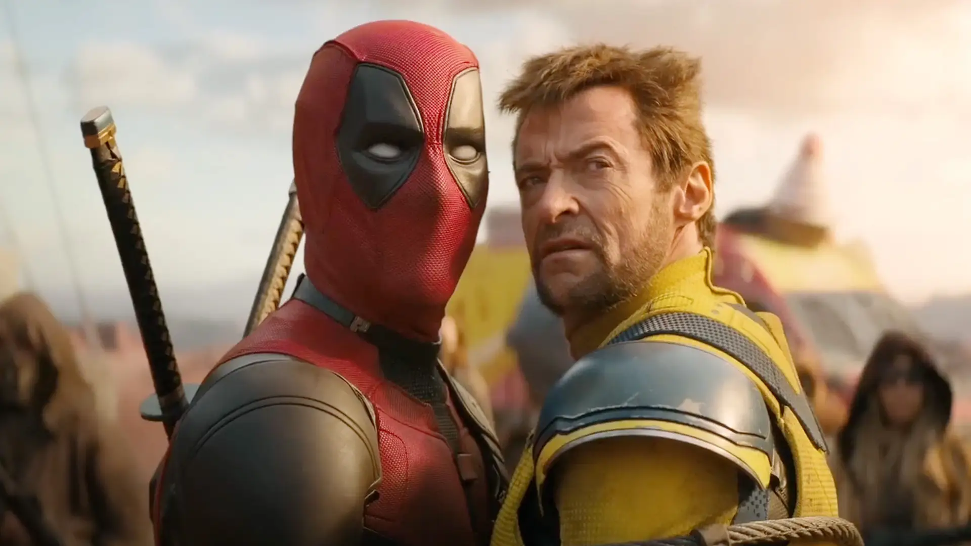 Deadpool and Wolverine standing cheek to cheek