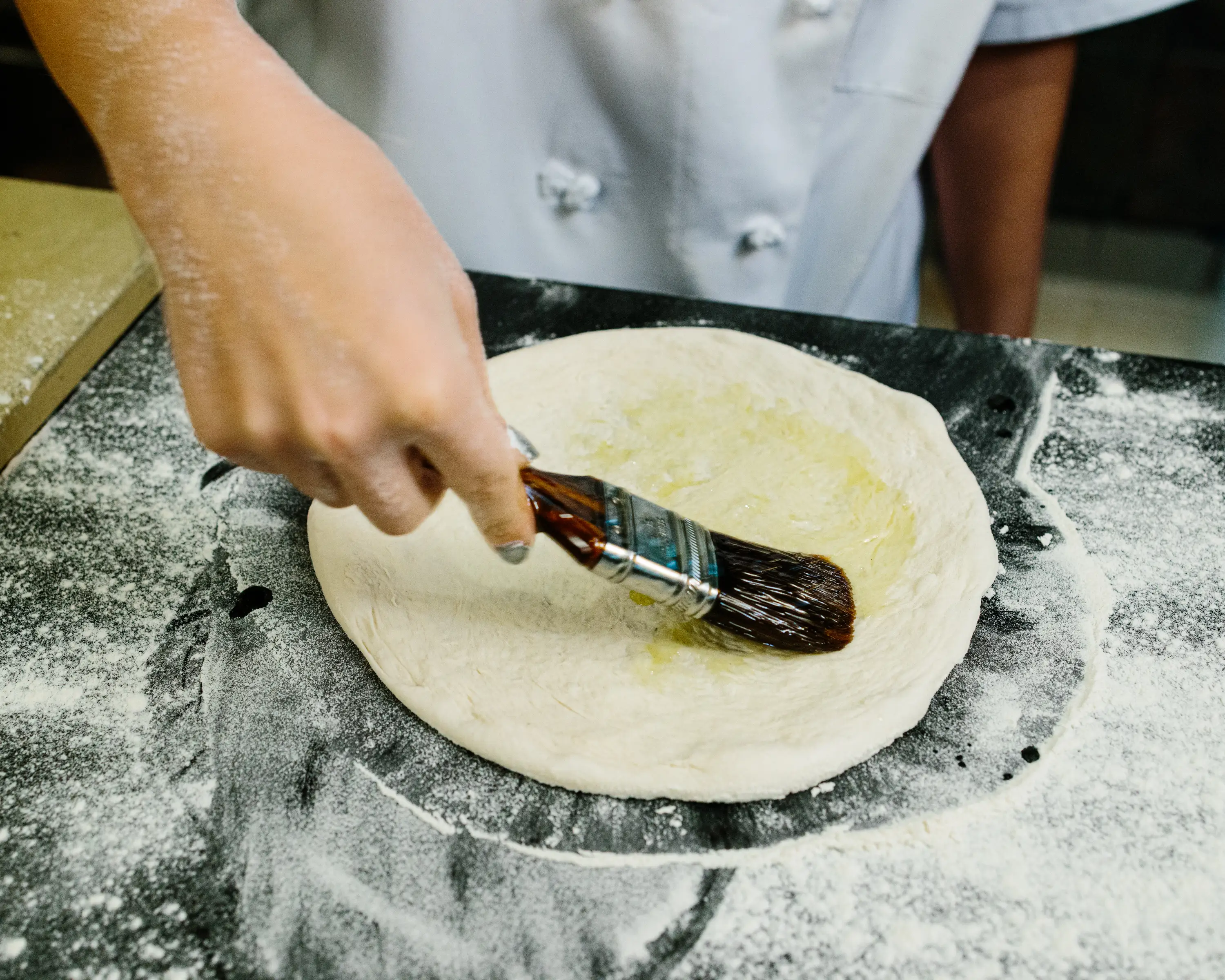 Making smoked salmon pizza