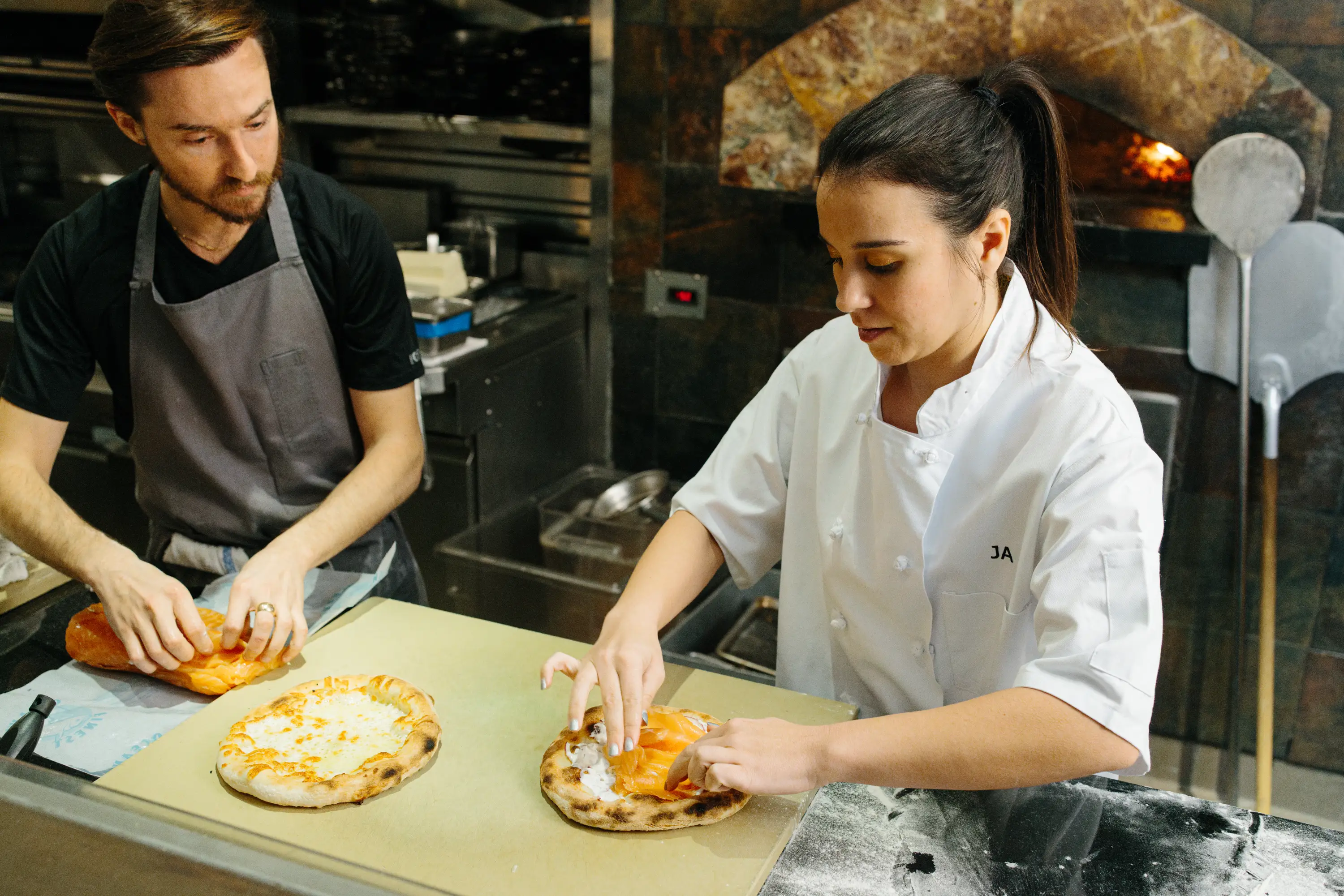 Making smoked salmon pizza